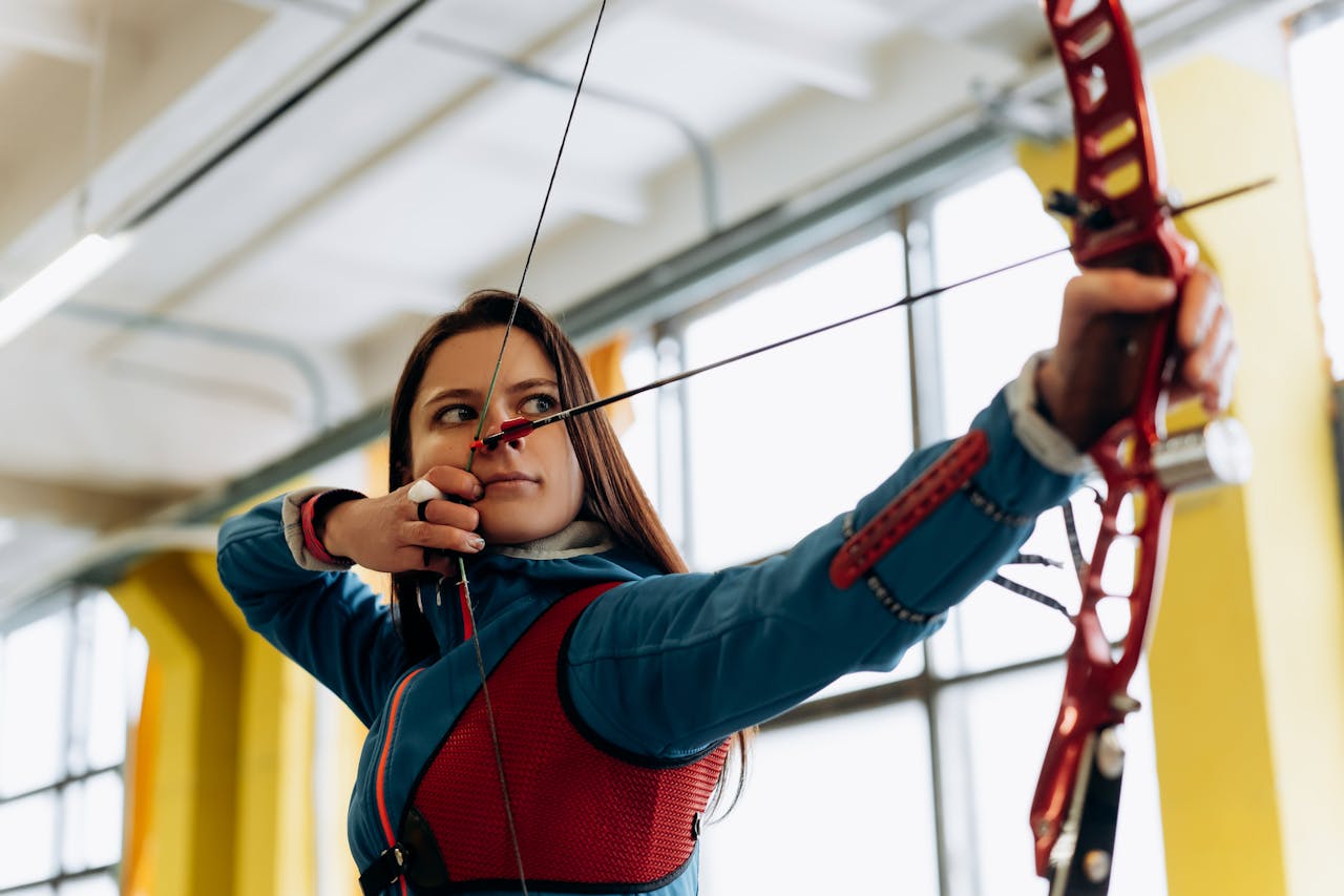 An archer aiming a bow