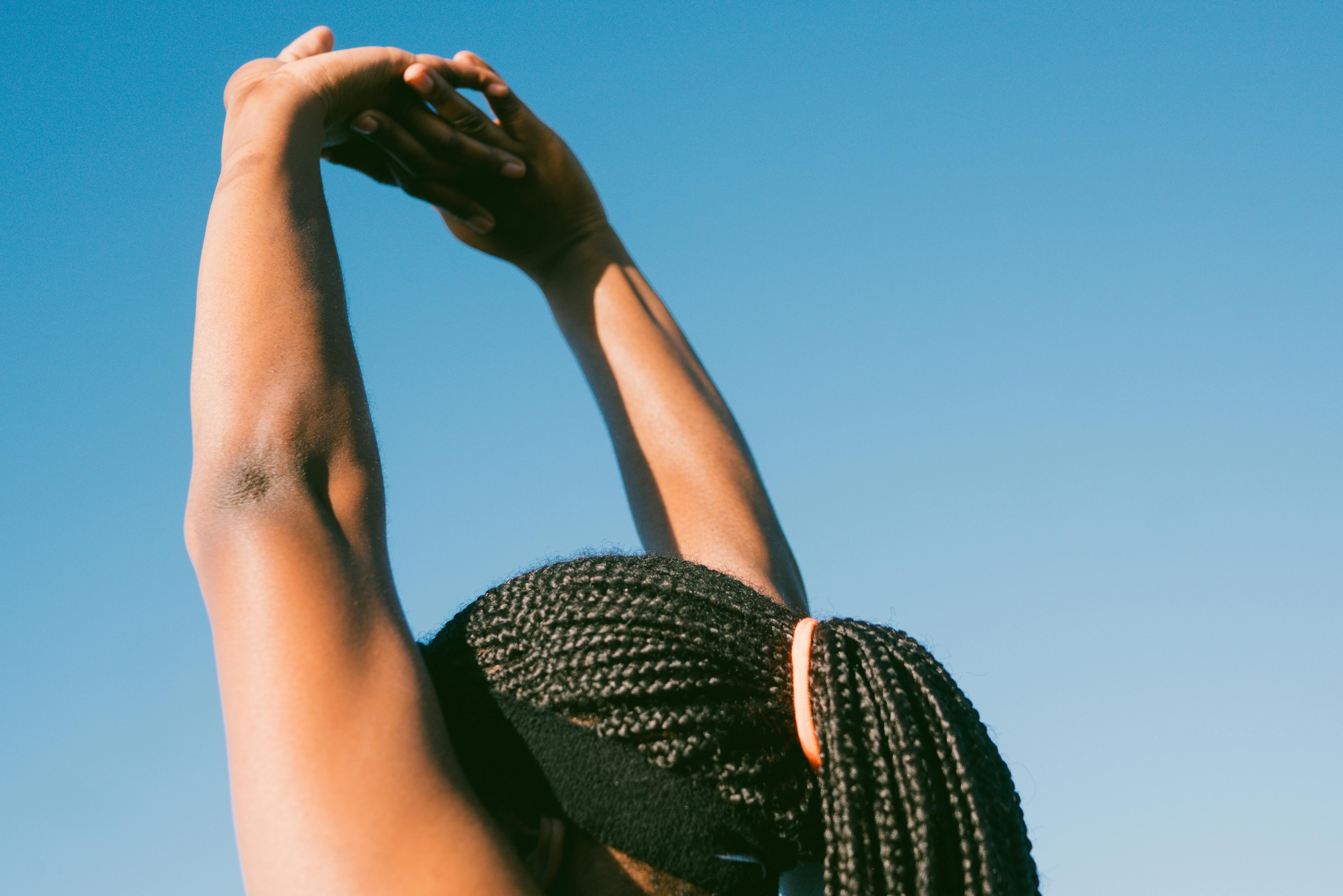 A person doing an arm stretch